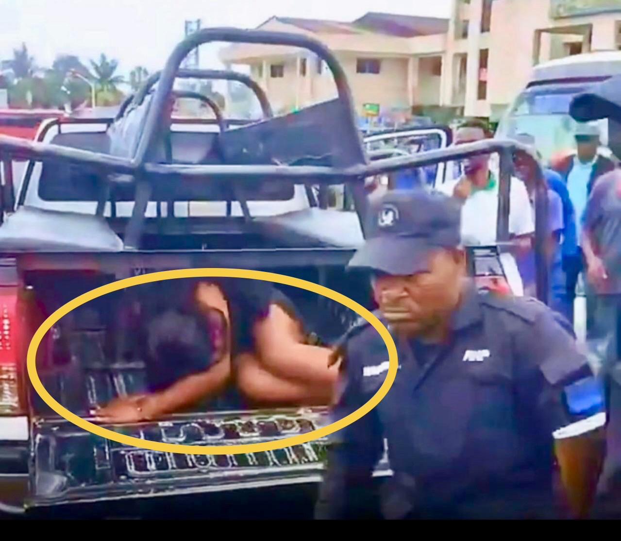 A woman was placed under a police car seat because of her outfit.