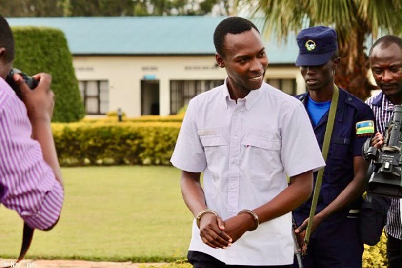 Cassien Ntamuhanga handcuffed by RNP.
